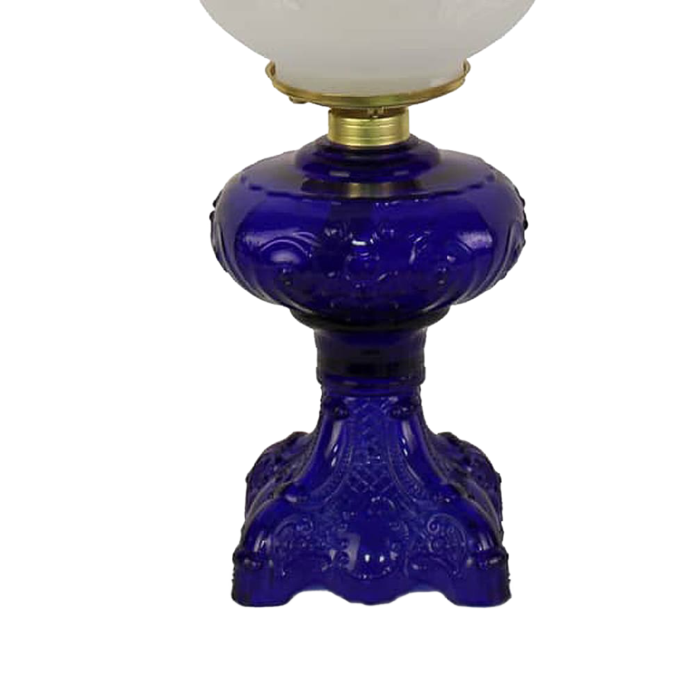 Handcrafted deep blue glass oil lamp base with intricate sculptured details, featuring a brass-plated burner and frosted glass chimney, ideal for Lamps & Lighting, Oil Lamps, Table Lamps, Best Sellers, Promo Eligible collections.