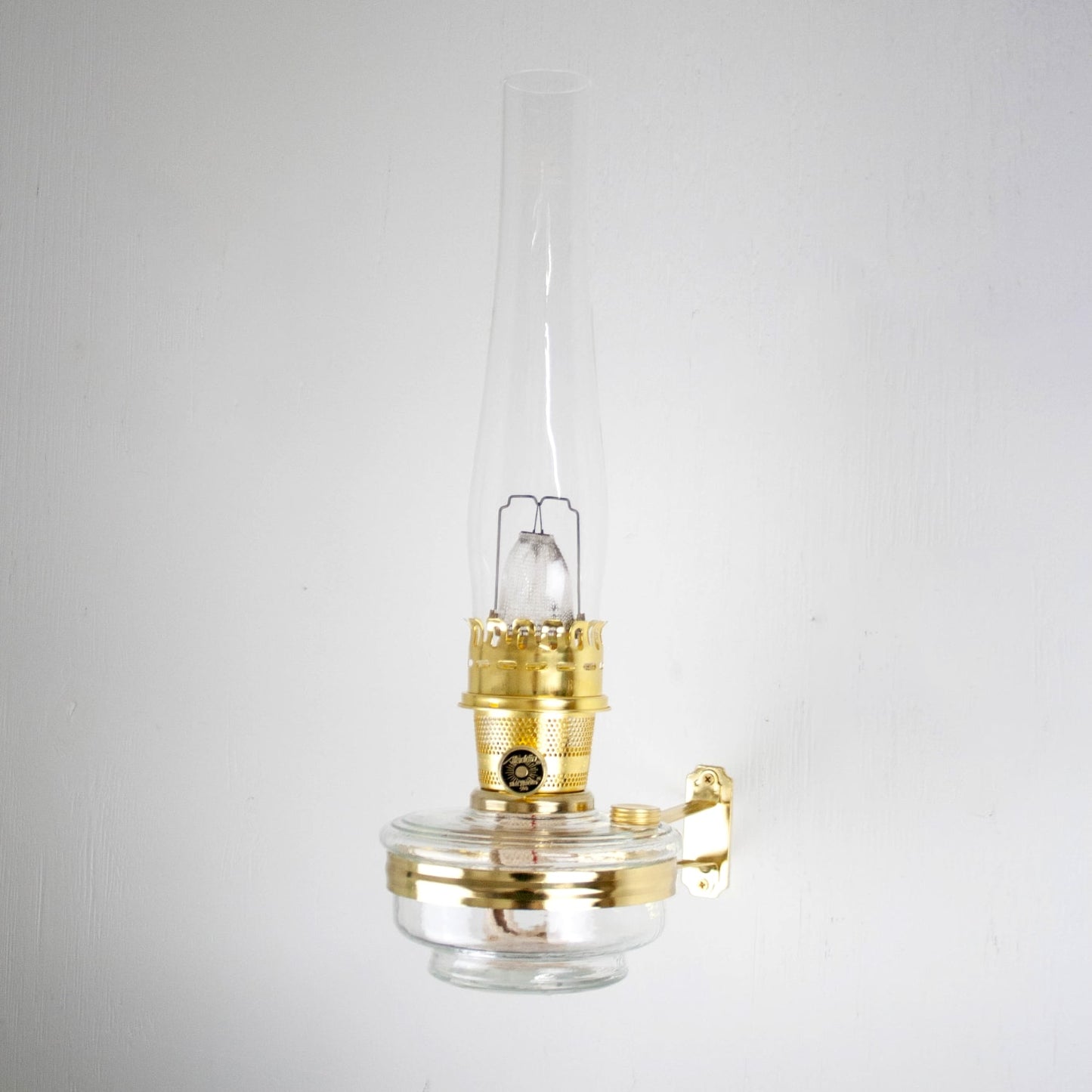 Handcrafted clear oil lamp with polished brass fittings and glass chimney, designed for wall mounting, ideal for Farm, Garden & Tool, Lamps & Lighting, and Emergency Supplies collections.