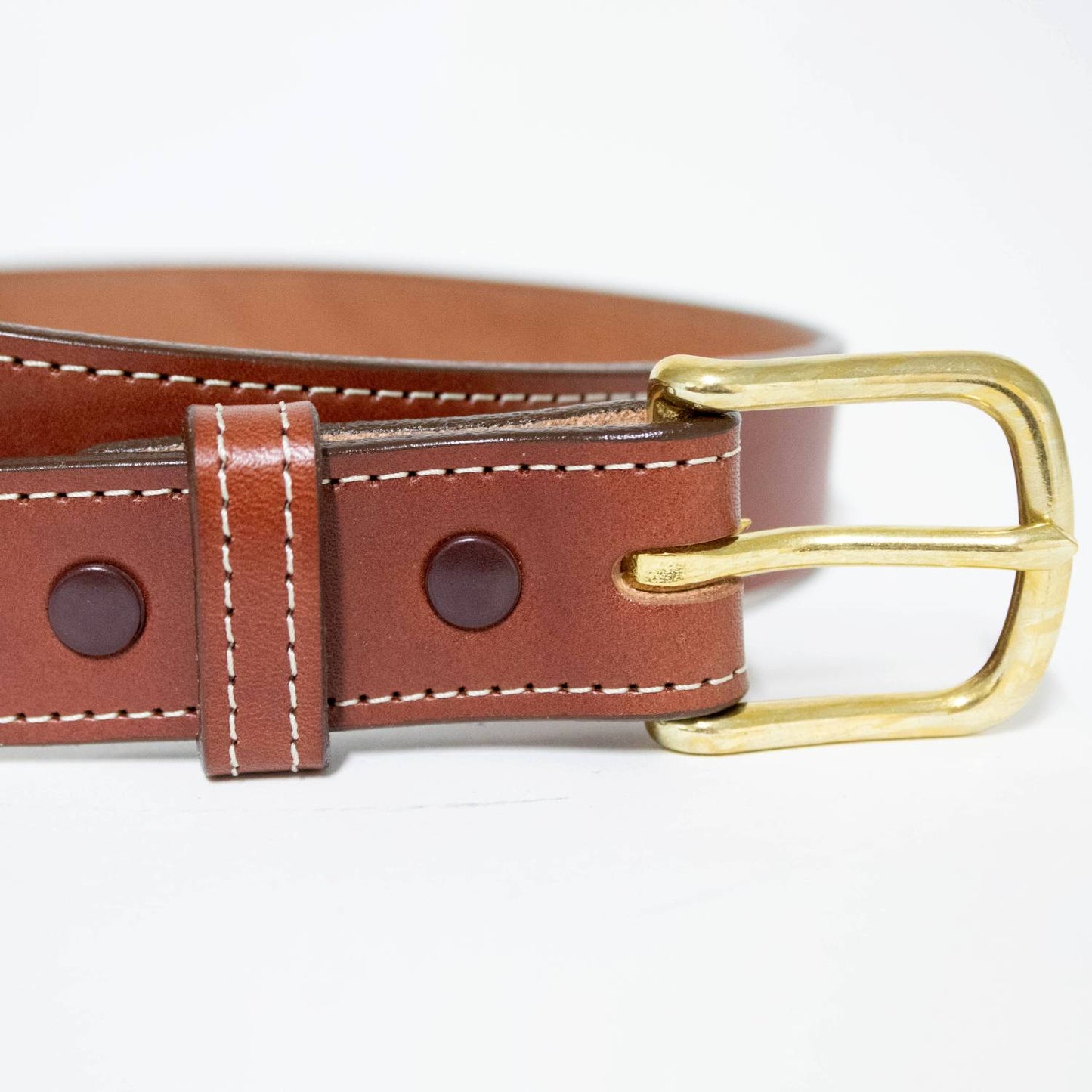 Handcrafted brown English bridle leather belt with fine white stitching and polished brass buckle, made in USA by Amish artisans, featured in Clothing and Accessories and Best Sellers collections.