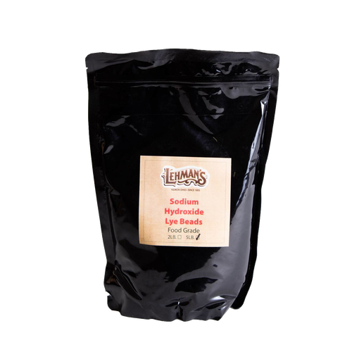 Resealable black pouch of food-grade sodium hydroxide lye beads with Lehman’s label, made in USA and featured in Health & Wellness, Soaps and Soapmaking, and Soapmaking Supplies collections.