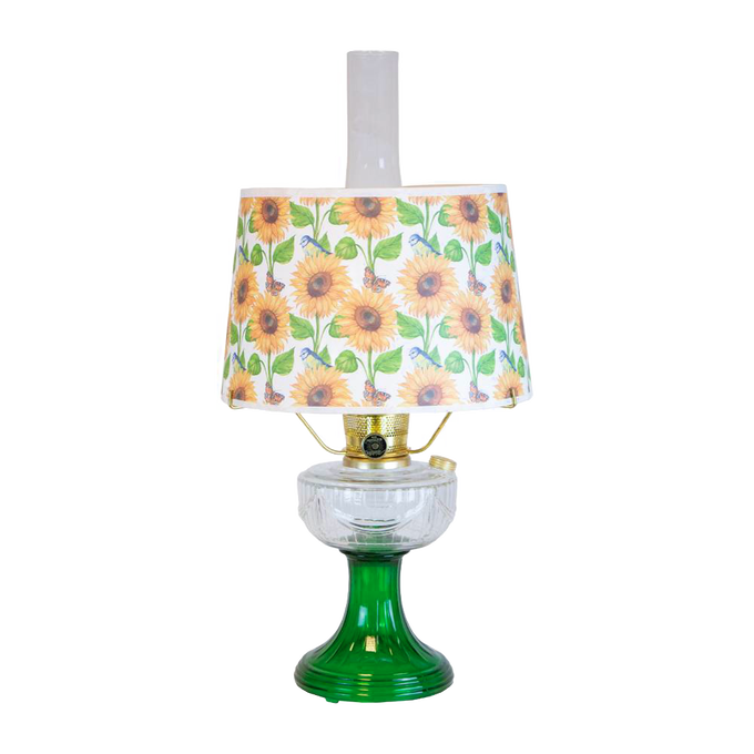 Handcrafted oil lamp with a clear chimney, featuring an Ohio-made emerald glass base and a bright sunflower-patterned shatterproof parchment shade, perfect for Farm, Garden & Tool, Lamps & Lighting, and Emergency Supplies collections.
