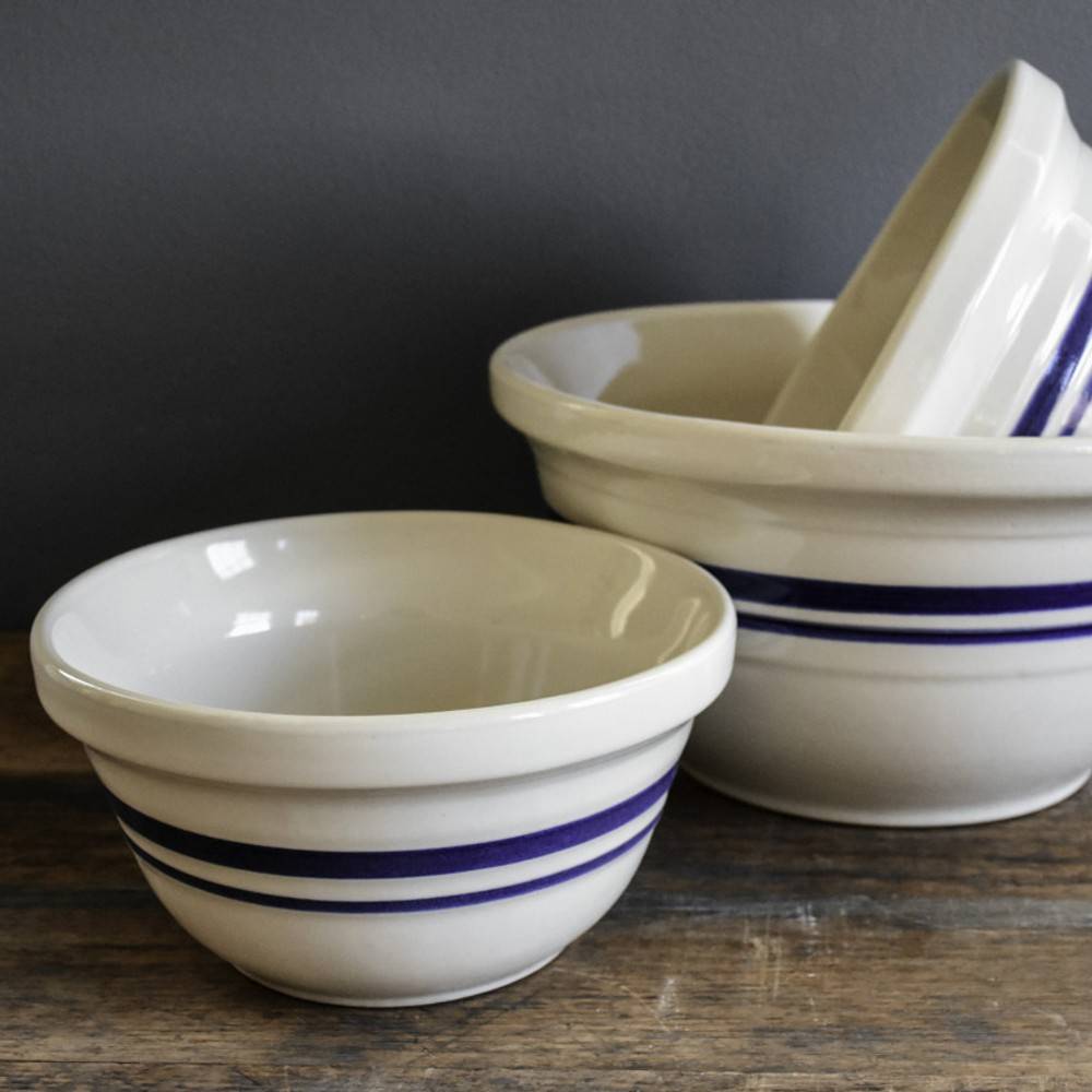 Set of handcrafted cream-colored ceramic mixing bowls with blue stripes, made in USA, perfect for Kitchen & Food, Cookware, Baking Supplies, and Storage and Serving collections.