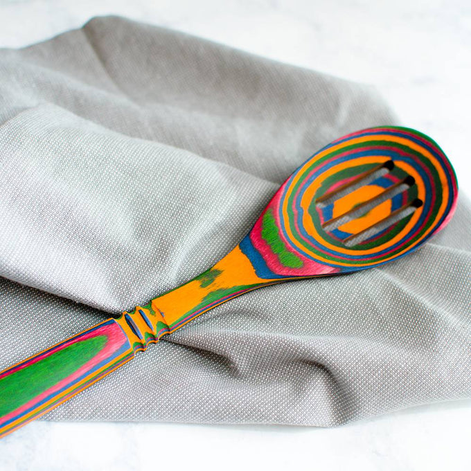Handcrafted pakkawood slotted spoon with a vibrant, multi-colored pattern, sturdy and heat resistant, ideal for Kitchen & Food, Kitchen Gadgets, Cooking and Baking Helpers, Storage and Serving, and Best Sellers collections.