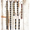 Assortment of handcrafted sleigh bell door hangers with brass and silver bells mounted on black and brown leather straps, perfect for holiday decor, USA made, best sellers.
