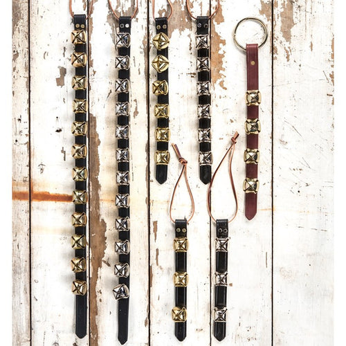 Assortment of handcrafted sleigh bell door hangers with brass and silver bells mounted on black and brown leather straps, perfect for holiday decor, USA made, best sellers.