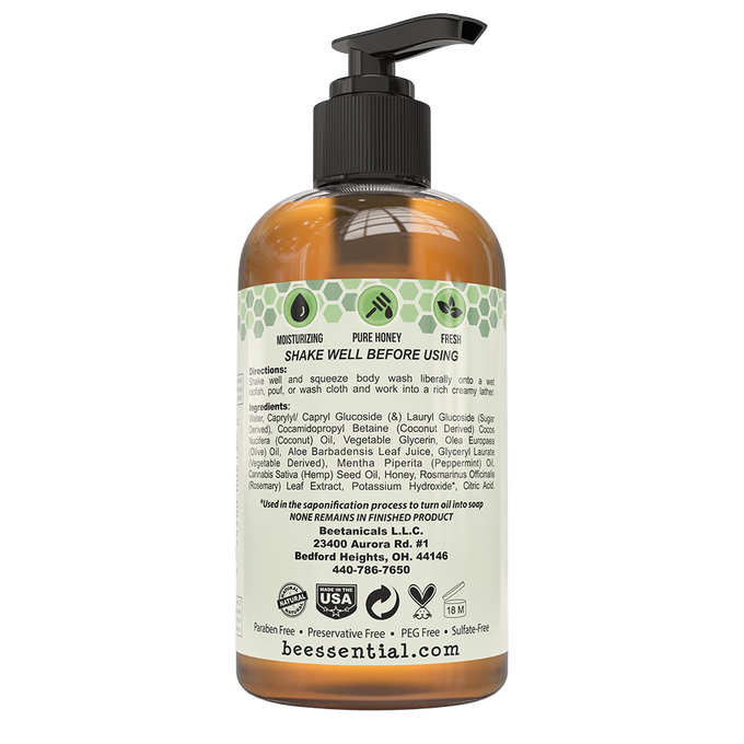 Amber pump bottle of natural body wash with bee and honeycomb icons, detailed ingredients list, usage instructions, and USA made label; featured in Health & Wellness and Soaps collections.