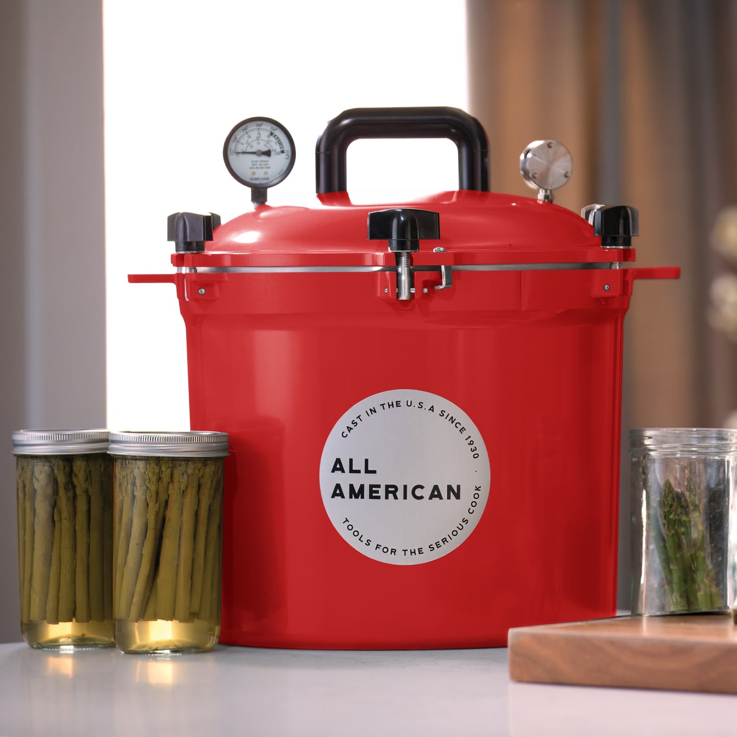 Handcrafted bright red pressure canner with secure locking lid, dual pressure gauges, and sturdy handle, made in USA for Kitchen & Food, Food Preservation, Canning, and Best Sellers collections.