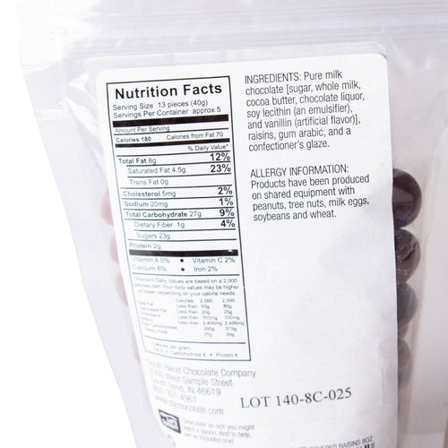 Back of resealable bag showing nutrition facts and ingredients for chocolate covered raisins, made in USA, featured in Kitchen & Food, Snacks and Sweets, Candy, USA Made, and Best Sellers collections.