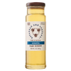 Clear glass jar of golden acacia raw honey with a simple white label featuring bee illustrations, sealed with a brown lid, ideal for kitchen and food pantry use.