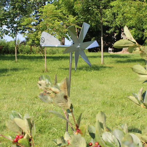 Unique handcrafted Amish-made windmill mole deterrent featuring shiny metal blades and tail vane mounted on a slender post, ideal for humane pest control in Farm, Garden & Tool, Lawncare, Pest Control, and Best Sellers collections.
