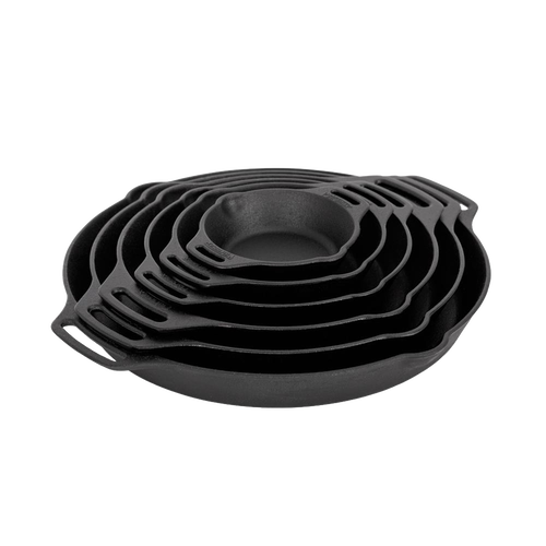 Stacked cast iron skillets with two side handles in varying sizes, designed for durable cooking in kitchen, camping, and farm settings, featured in cookware and cast iron collections.