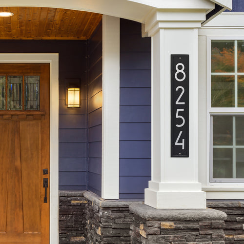 Handcrafted vertical custom address plaque in black with silver modern numbers mounted on white porch column, enhancing curb appeal for Home & Decor, Household Helpers, Mailboxes and Address Signs, USA Made, and Best Sellers collections.
