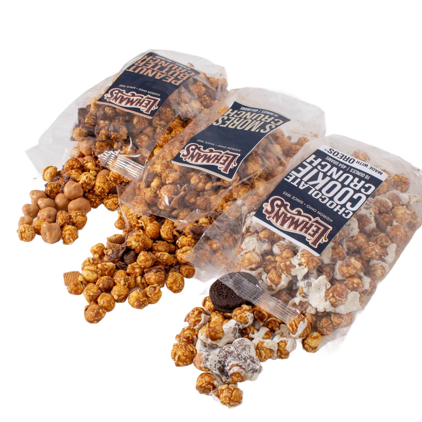 Three clear bags of Lehman's caramel popcorn varieties spilling out savory and sweet mixes featuring chocolate cookies, peanut butter bites, and s'mores crunch, part of Kitchen & Food, Snacks and Sweets, Popcorn, USA Made, and Best Sellers collections.