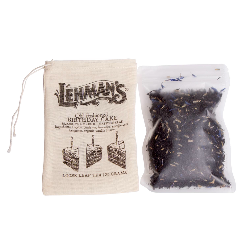Small muslin drawstring bag labeled Lehman's Old Fashioned Birthday Cake loose leaf tea next to a clear pouch of loose black tea leaves, a USA made beverage from Kitchen & Food, Food, Beverages, Best Sellers, and Promo Eligible collections.