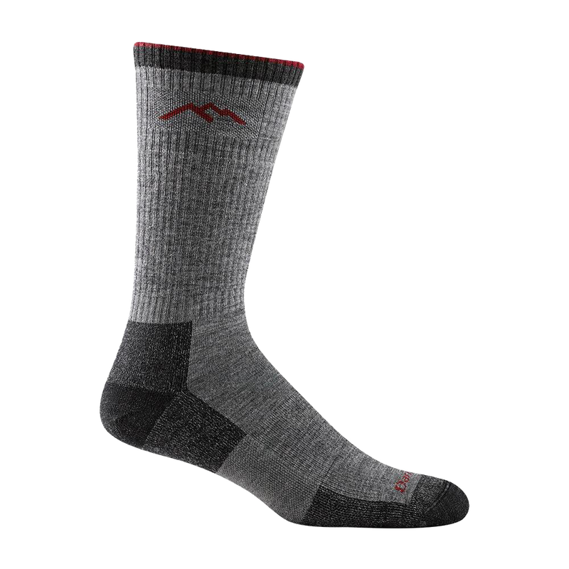 Gray mid-calf hiking sock with cushioned sole, reinforced heel and toe, featuring mountain logo and red trim, crafted for durability and comfort in Health & Wellness and Camping collections.