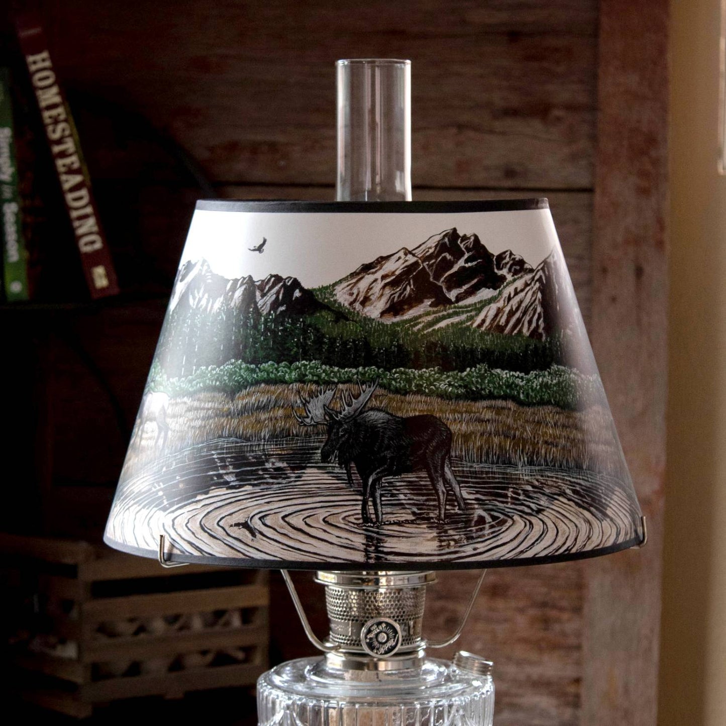 Handcrafted parchment oil lamp shade featuring a detailed Rocky Mountain scene with a moose standing in a rippled pond, surrounded by forest and rugged peaks, ideal for Lamps & Lighting, Parts and Accessories, Lamp Shades, and Best Sellers collections.