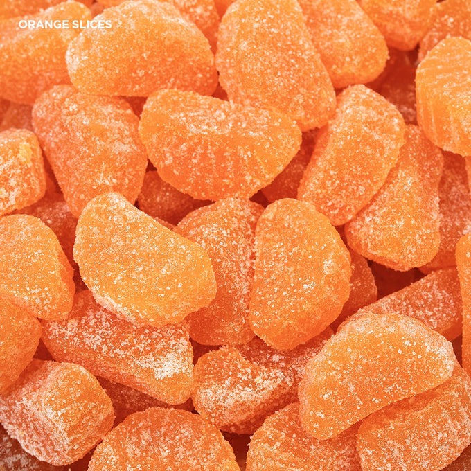 Close-up of bright orange sugar-coated slice candies with a chewy texture, representing handcrafted nostalgic sweets from Kitchen & Food, Food, Snacks and Sweets, Best Sellers, and Promo Eligible collections.