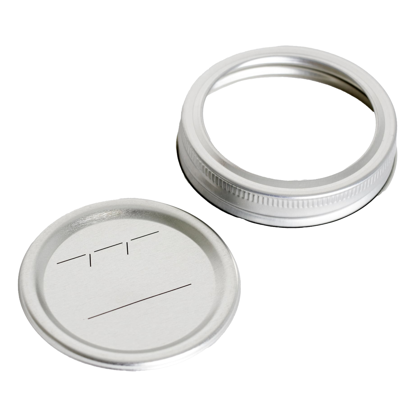 Silver metal regular-mouth canning jar lid and matching band with BPA-free sealing compound, featuring simple black labeling lines, ideal for kitchen food preservation and canning collections.