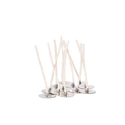 Group of white cotton candle wicks attached to round metal sustainers, essential for beginner soy candle making in candlemaking supplies and lighting collections.