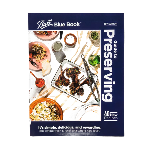 Guide to preserving book with vivid food photography on cover, featuring cooked dishes and ingredients; a useful resource for Kitchen & Food, Food Preservation, and Canning collections.