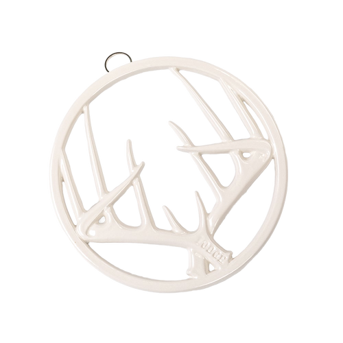 Off-white enamel trivet with an antler motif, featuring durable chip-resistant finish, rubber feet for stability, and a built-in hanger, ideal for Kitchen & Food, Dinnerware, Storage and Serving, Best Sellers, and Promo Eligible collections.