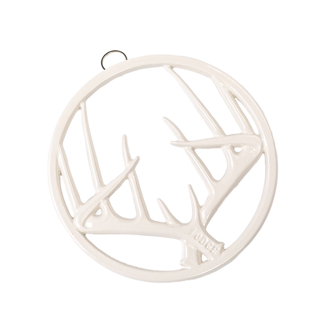 Off-white enamel trivet with an antler motif, featuring durable chip-resistant finish, rubber feet for stability, and a built-in hanger, ideal for Kitchen & Food, Dinnerware, Storage and Serving, Best Sellers, and Promo Eligible collections.