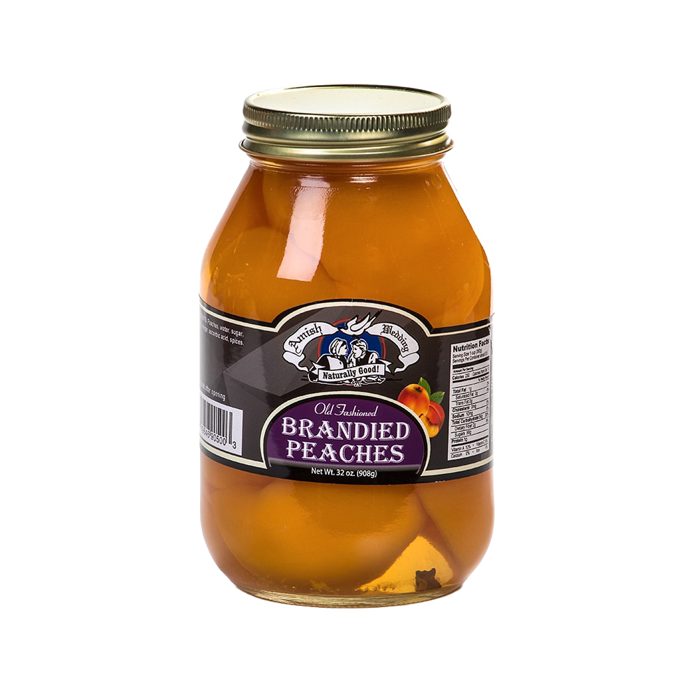 Glass jar of old-fashioned brandied peaches with a metal lid, showcasing preserved fruit in syrup, featured in Kitchen & Food, Food, Pantry, USA Made, Best Sellers, Promo Eligible collections.
