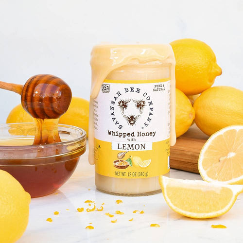 Handcrafted whipped honey with lemon flavor in a glass jar, surrounded by fresh lemons and honey dipper, perfect for Pantry, Best Sellers, and Kitchen & Food collections.