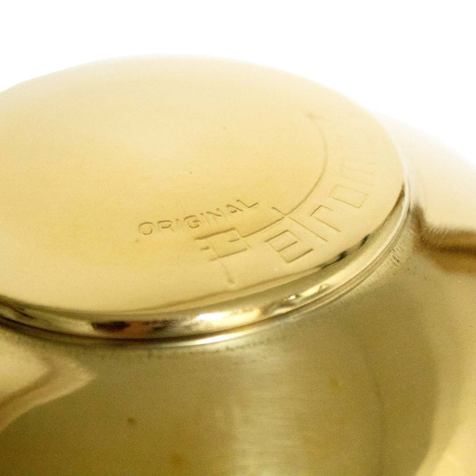 Close-up of a polished brass Petromax lamp hood featuring embossed branding, ventilation holes around the edge, designed for HK350 and HK500 models, featured in Lamps & Lighting and Parts and Accessories collections.
