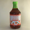 Bottle of handcrafted peach tea concentrate with bright green cap and label featuring peach illustrations, made in USA, ideal for Kitchen & Food, Beverages, and Best Sellers collections.