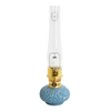 Handcrafted limited edition oil lamp with distinctive blue glass base, brass burner, and tall clear chimney, featured in Lamps & Lighting, Oil Lamps, Table Lamps, Best Sellers, and Promo Eligible collections.