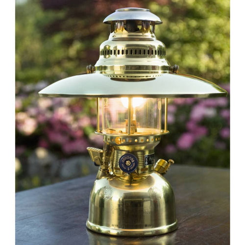 Shiny metal top reflector attached to a vintage-style pressure lamp, enhancing light direction for outdoor or indoor use, featured in lamps and lighting accessories collections.