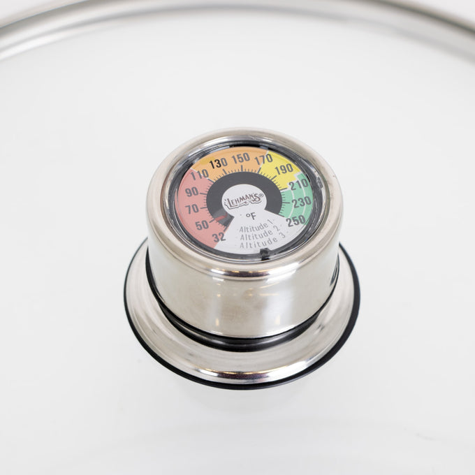 Close-up of a built-in temperature gauge on a stainless steel water bath canner lid, designed for precise heat control in food preservation, featured in Kitchen & Food and Canning collections.