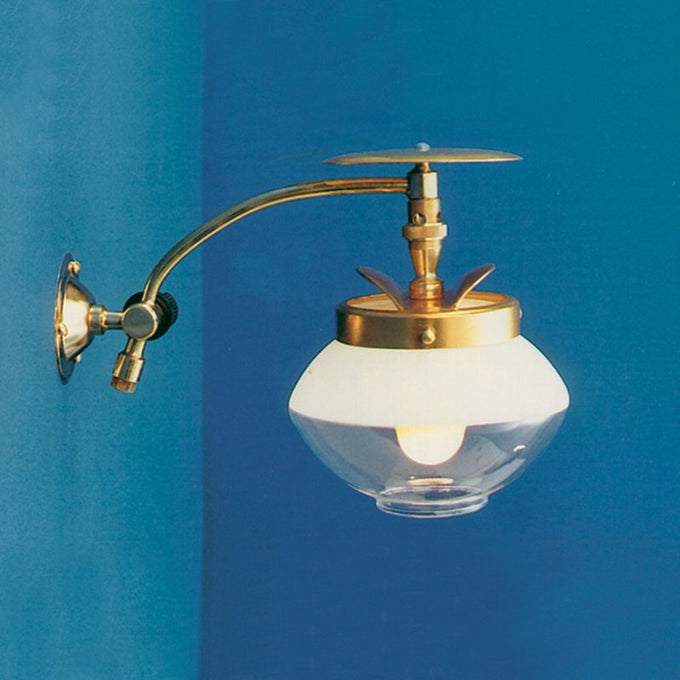 Handcrafted brass single wall light with a clear glass globe and adjustable arm, designed for low-maintenance gas lighting in Lamps & Lighting, Gas Lights, Best Sellers, and Promo Eligible collections.