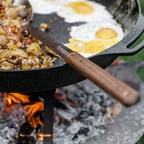 Handcrafted stainless steel serving spoon with a long walnut handle, ideal for portioning outdoor meals over campfire skillets in Farm, Garden & Tool, Kitchen & Food, Camping, Storage and Serving, Best Sellers, and Promo Eligible collections.