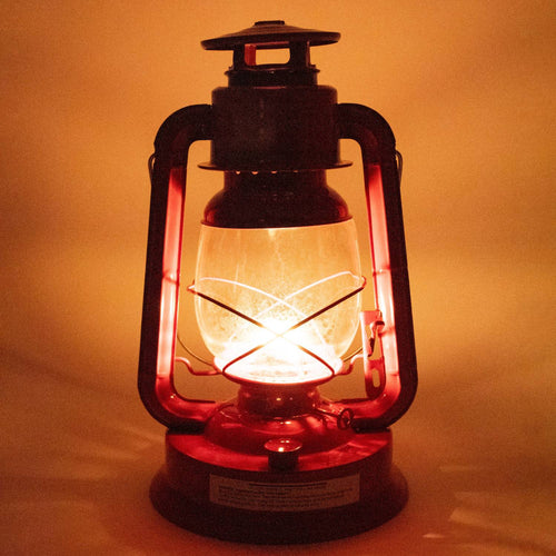 Handcrafted bright red Rayo Redi-Lite Lantern glowing warmly, designed for reliable outdoor and emergency lighting, featured in Farm, Garden & Tool, Camping, and Best Sellers collections.