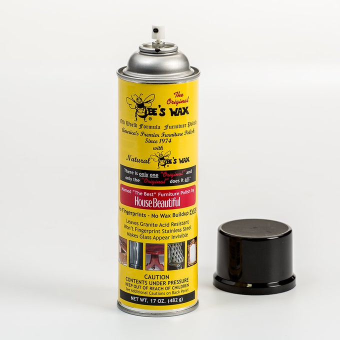 Yellow spray can of Bee's Wax furniture polish with black cap removed, featuring vintage-style text and images promoting no wax buildup, fingerprint resistance, and granite protection, ideal for Home & Decor, Household Cleaning, Cleaners and Polishes, USA Made, Best Sellers, and Promo Eligible collections.