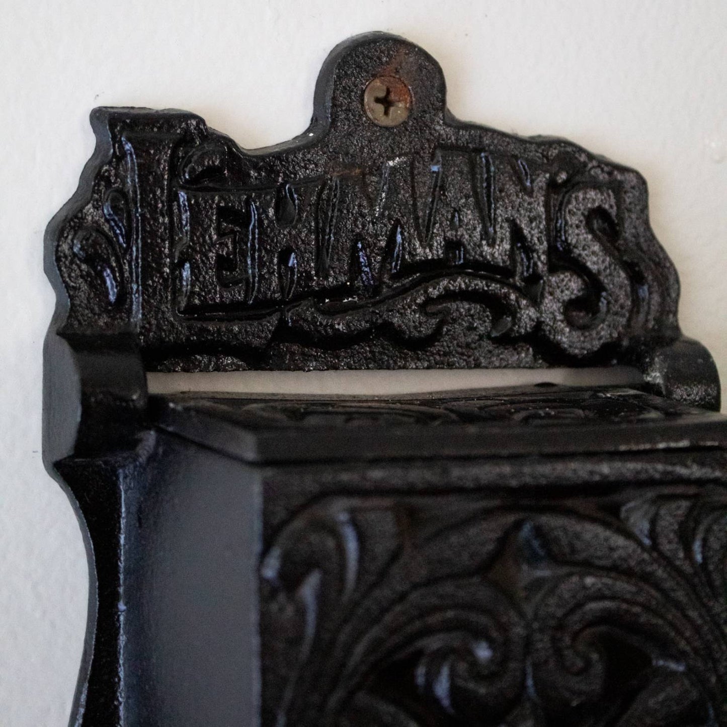 Handcrafted black metal wall-mounted matchbox holder with embossed decorative scrollwork and Lehman's branding, made in USA, ideal for Home & Decor, Household Helpers, and Best Sellers collections.