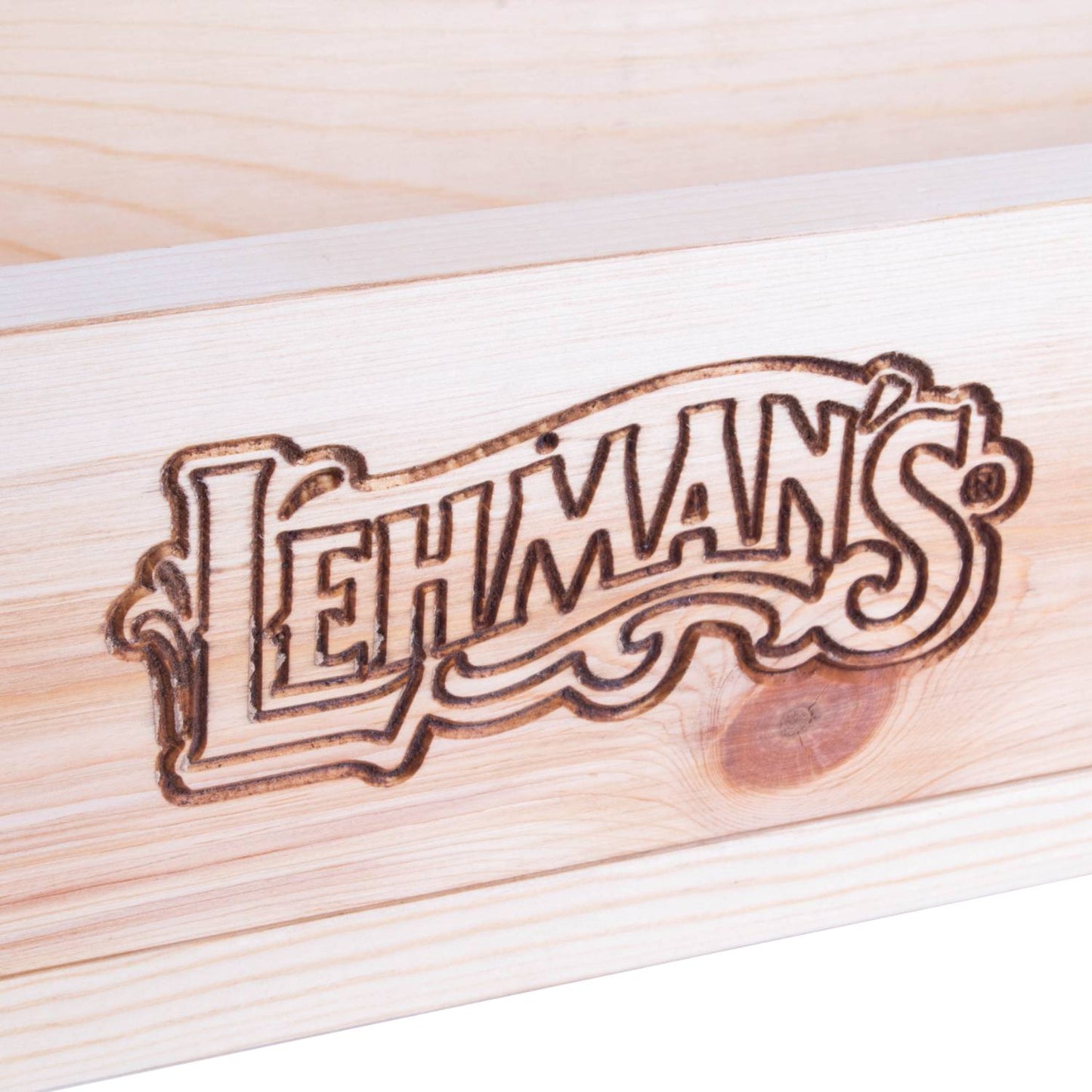 Close-up of a handcrafted wooden soap mold made from smooth pine featuring a carved Lehman’s logo, designed for cold process soapmaking in Health & Wellness and USA Made collections.
