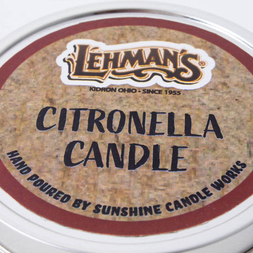 Close-up of a hand-poured citronella candle tin lid featuring Lehman's branding, crafted for outdoor use in camping, pest control, and garden lighting collections.