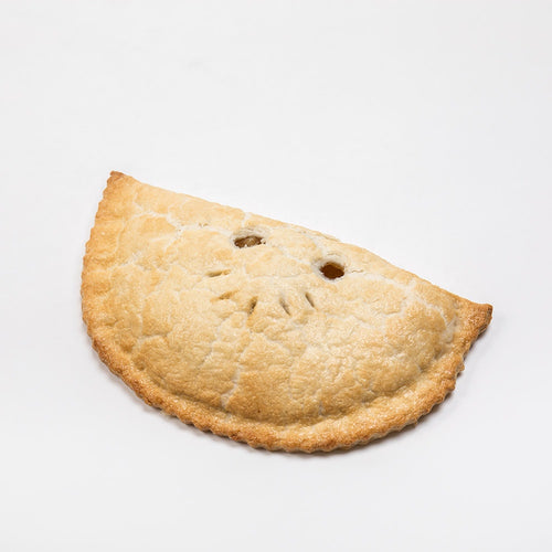 Generously sized golden-brown fruit turnover with decorative vent holes, showcasing a handcrafted treat from USA Made, Snacks and Sweets, and Kitchen & Food collections.