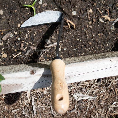 Handcrafted garden hoe with a smooth wooden handle and double-sided metal blade, designed for effective weed removal in Farm, Garden & Tool, Garden Accessories, Best Sellers, Promo Eligible collections.
