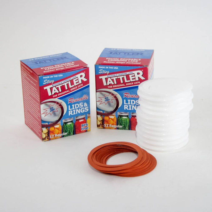 Two boxes of handcrafted reusable canning lids and orange sealing rings made in USA, designed for regular mouth jars, ideal for Kitchen & Food, Food Preservation, and Canning collections.