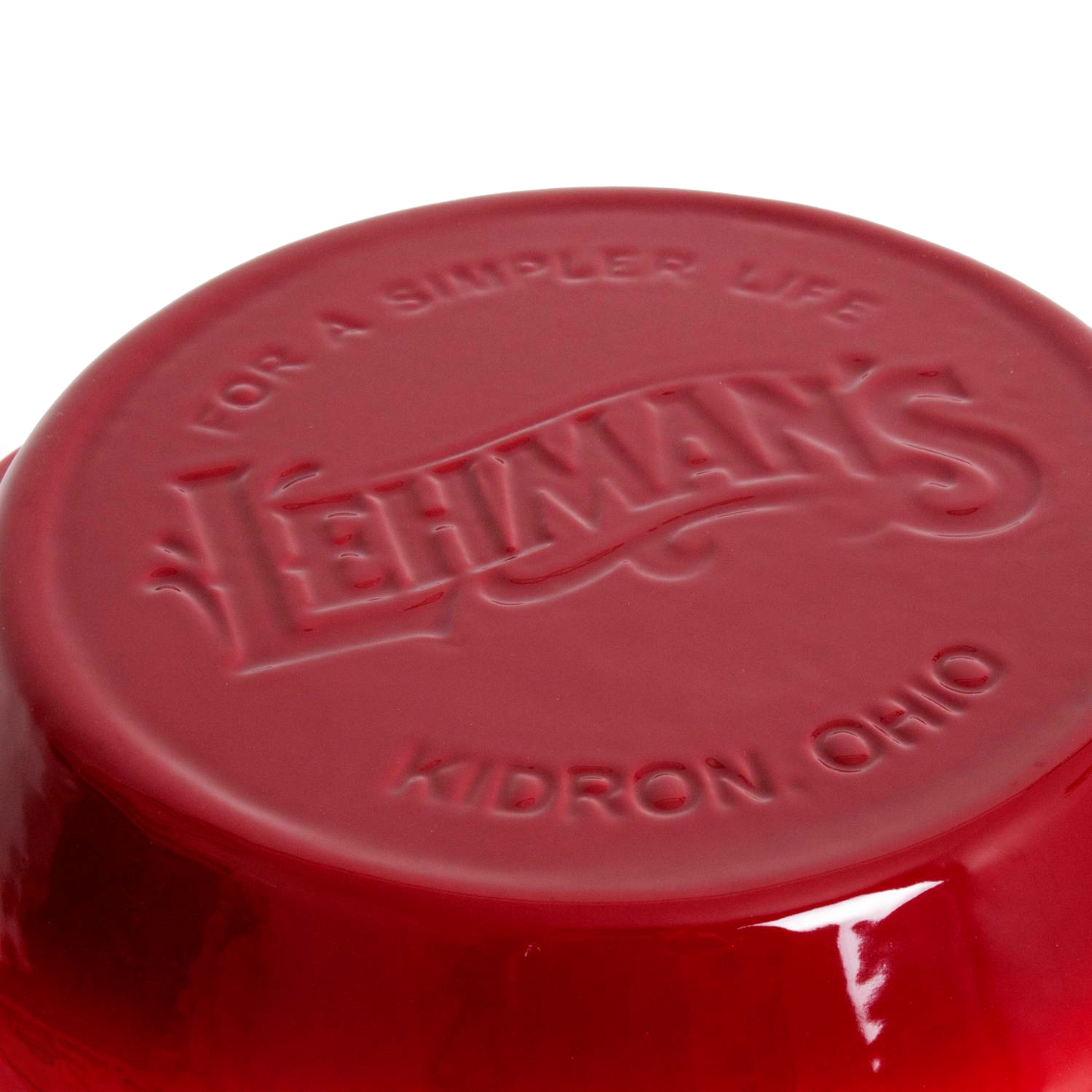 Close-up of the bottom of a handcrafted red ceramic kitchen bowl embossed with Lehman’s logo and location, ideal for Kitchen & Food and Cookware collections.