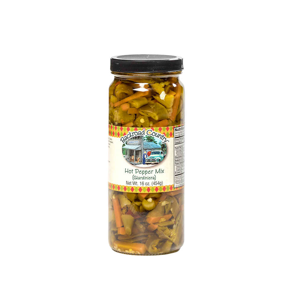 Tall glass jar of handcrafted hot pepper mix with visible sliced peppers and vegetables, made in USA, ideal for Kitchen & Food, Pantry, and Best Sellers collections at Lehman’s.