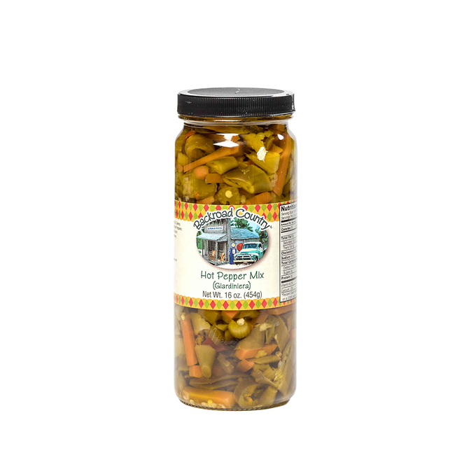 Tall glass jar of handcrafted hot pepper mix with visible sliced peppers and vegetables, made in USA, ideal for Kitchen & Food, Pantry, and Best Sellers collections at Lehman’s.