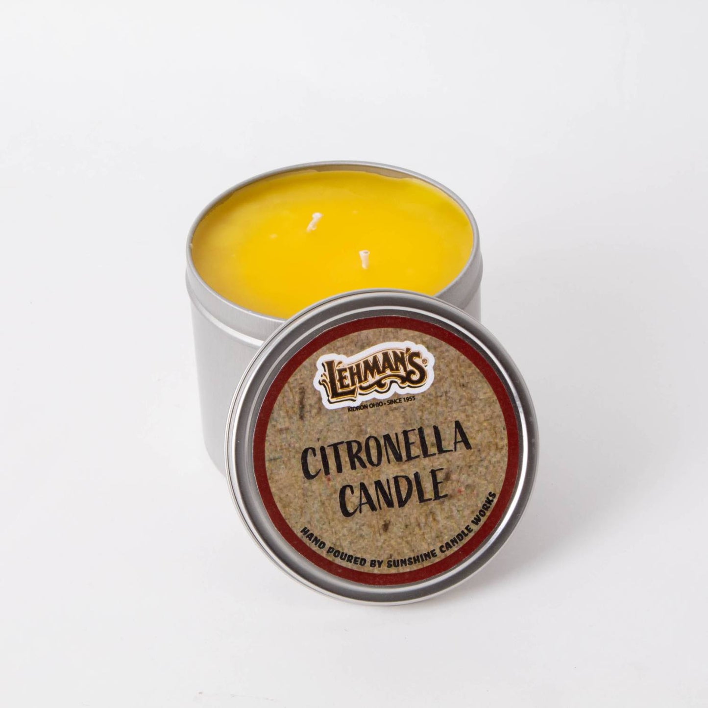 Hand-poured Lehman's citronella candle with bright yellow wax in a compact metal tin featuring two wicks, perfect for outdoor use in camping, pest control, and garden lighting collections.