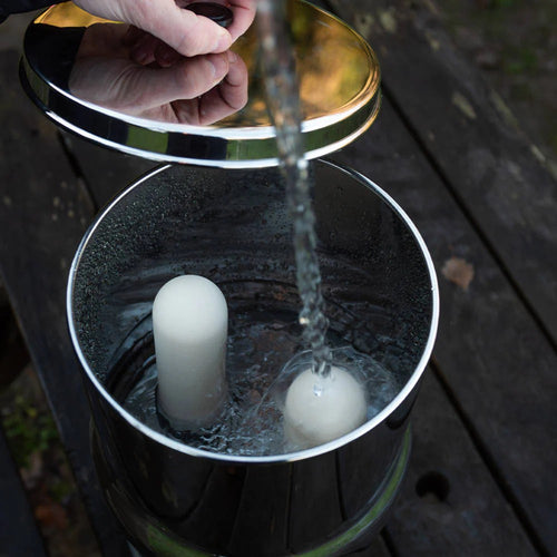 Handcrafted stainless steel gravity water filter chamber with white ultra fluoride ceramic filter elements being filled with water, suitable for Farm, Garden & Tool, Appliances, Emergency Supplies, and Water Heating and Treatment collections.