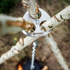 Stainless steel tripod connector disc with three branches secured by a bolt and chain, designed for building sturdy outdoor branch tripods, featured in Farm, Garden & Tool and Camping collections.