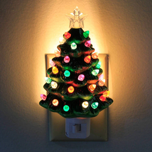 Handcrafted ceramic Christmas tree nightlight with colorful bulbs and a star topper, emitting a warm glow, perfect for Home & Decor, Holiday Decor, Best Sellers, and Promo Eligible collections.